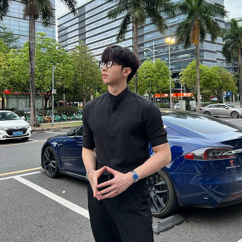 Black half-sleeve stand-collar shirt, side profile showing button placket.