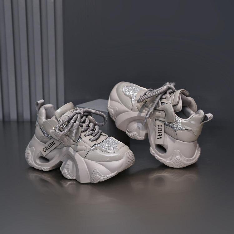 Women’s platform sports sneakers in light gray with sparkly side panels and gray laces