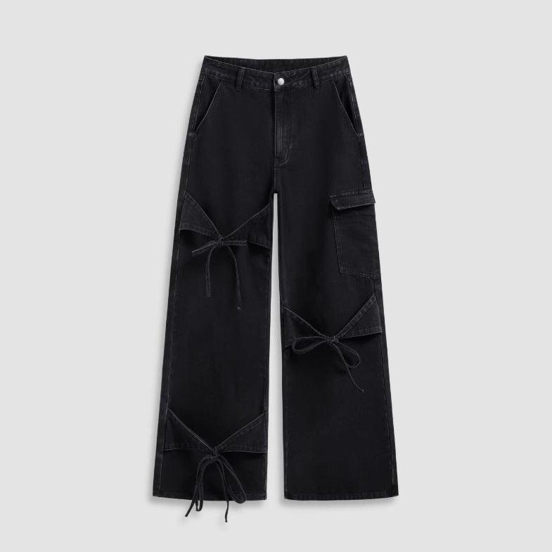 Black wide-leg pants with patchwork cargo panels and front drawstring ties