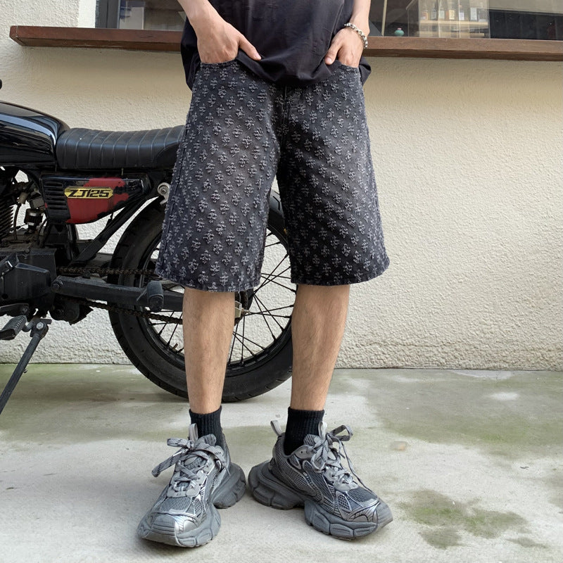 Black five-point denim shorts with small allover pattern, loose straight fit, folded hem