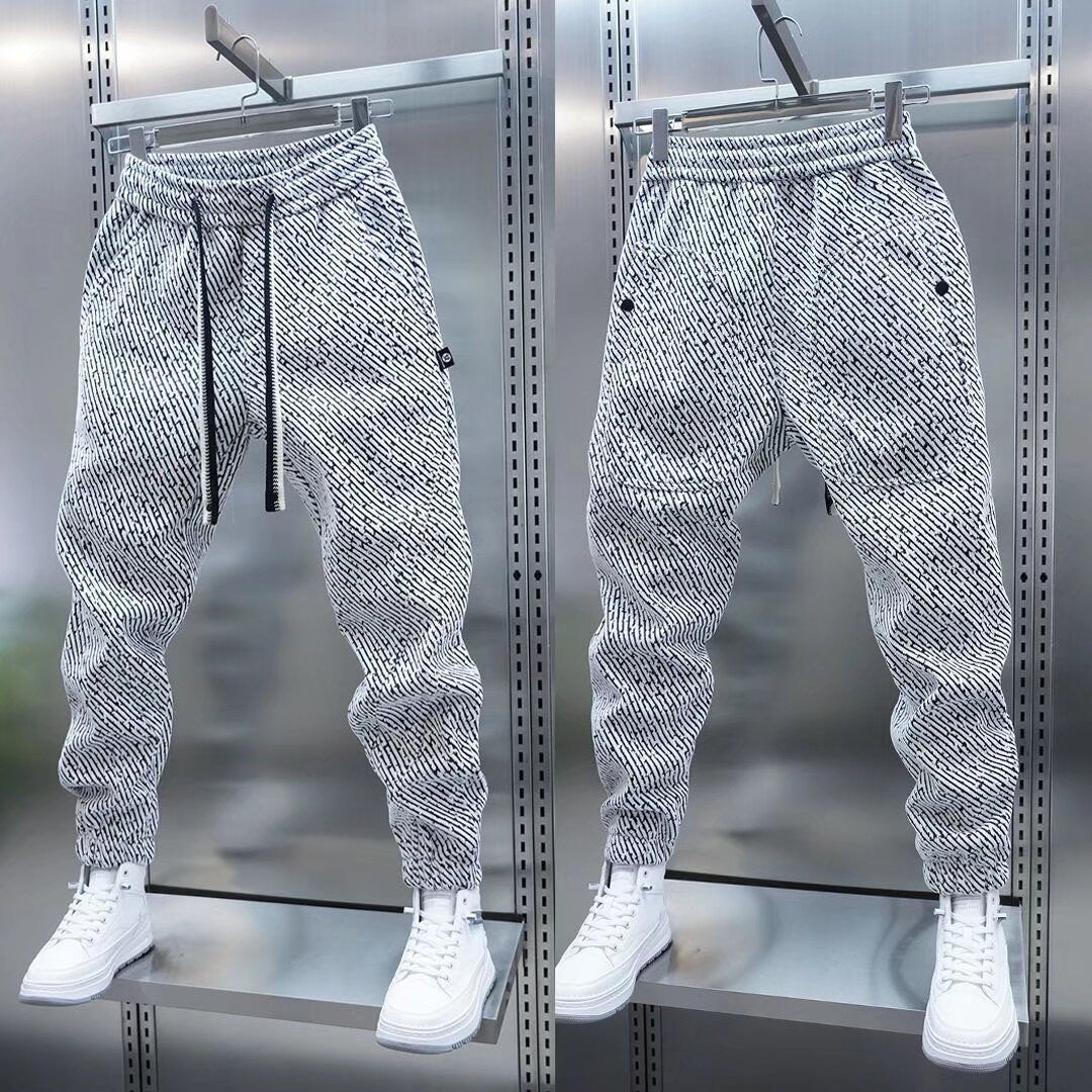 Men's loose sweatpants, heather gray speckled, drawstring waist, cuffed ankles.
