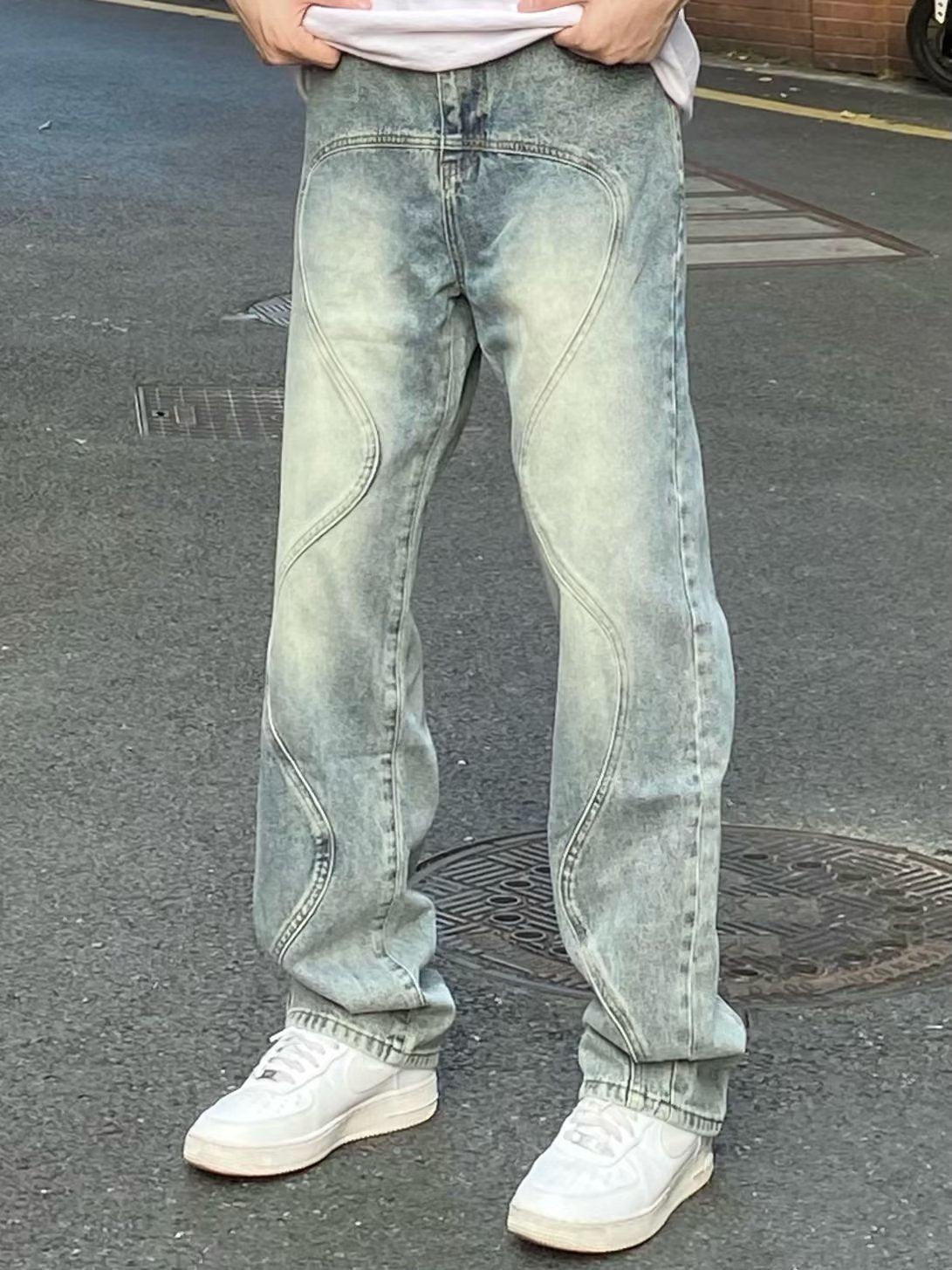 Men's loose wide-leg jeans, faded blue-green wash with curved seam details