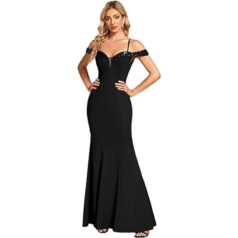Black off-shoulder evening gown with jeweled neckline straps, fitted mermaid silhouette