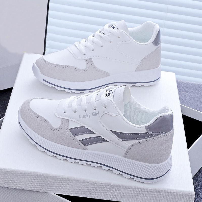 Women's lace-up running sneakers, white with light gray paneling and contrast gray stripe