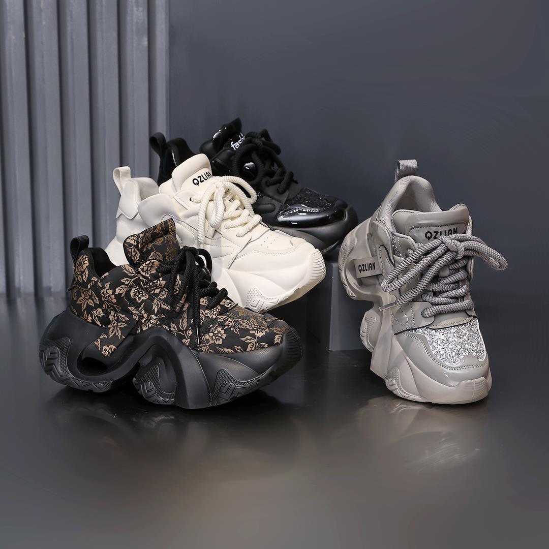 Women’s platform sports sneakers with black floral upper and chunky rubber sole