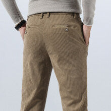 Brown khaki corduroy pants with straight legs and stitched front creases