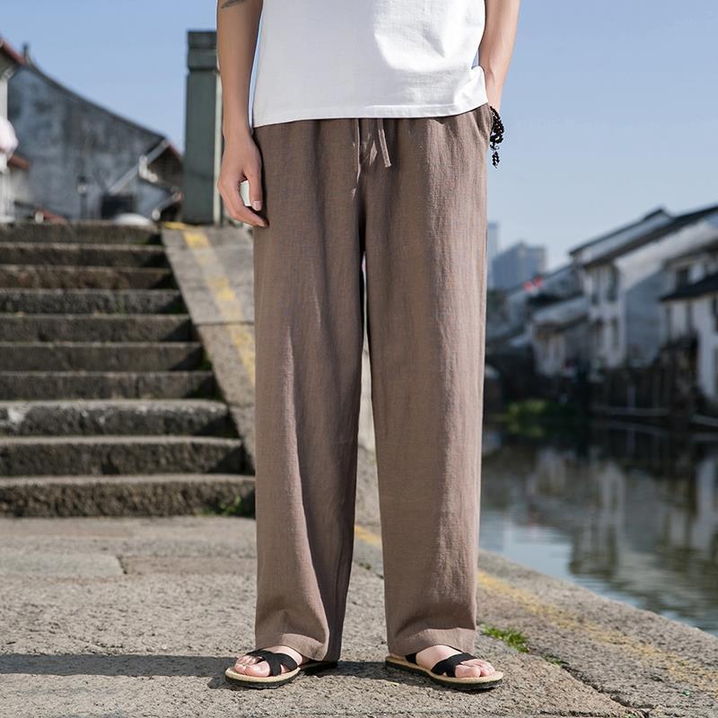 Loose cotton-linen trousers in dark brown with straight wide legs and drawstring waist