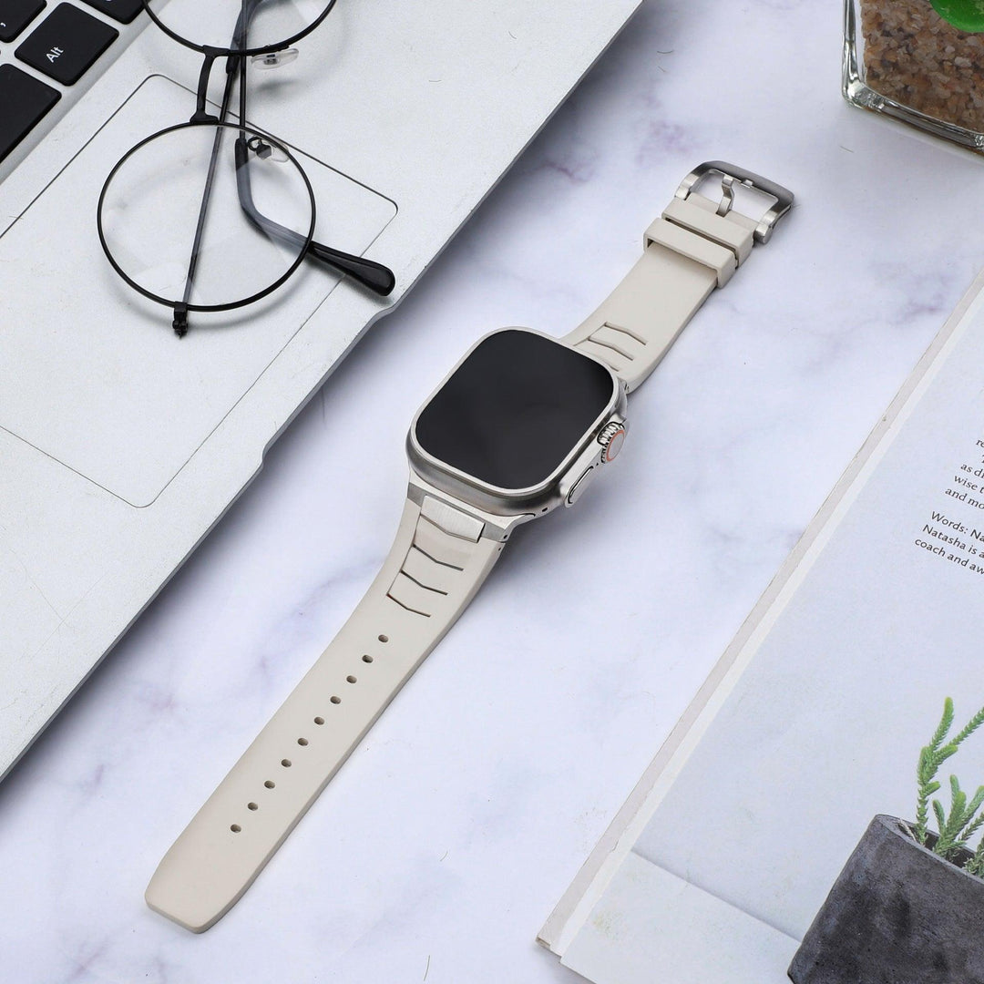 Light beige sports watch strap with silver buckle and perforation holes
