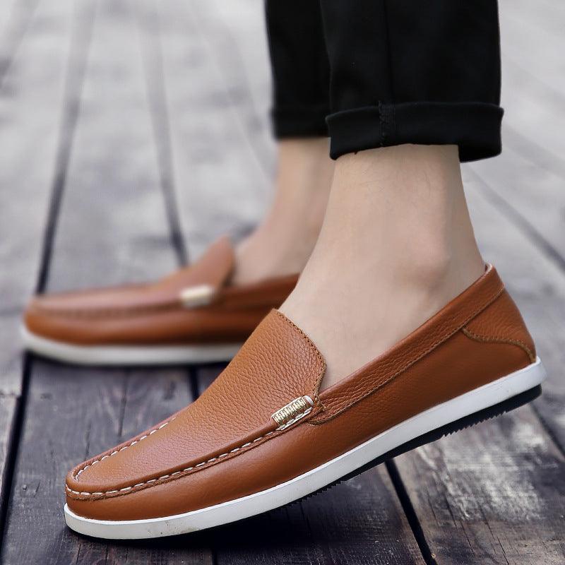 Brown leather slip-on casual shoes with gold bit detail and white rubber sole