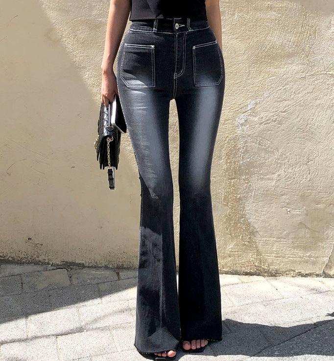 High-waist dark denim flared pants with back pockets, back view