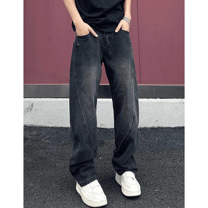 Men's wide-leg dark denim jeans with a large flap pocket and contrast seams