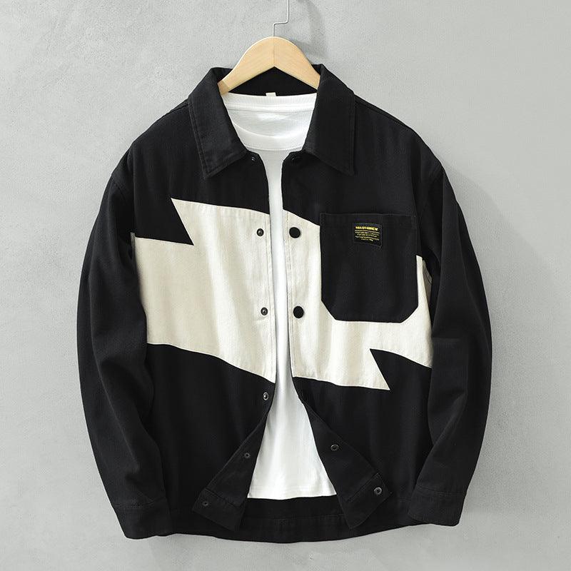 Black button-up shirt with cream geometric patchwork panels and chest pocket