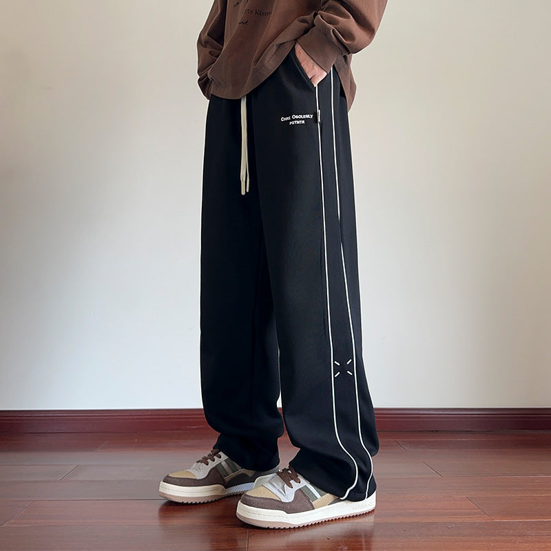 Men's black loose straight casual pants, white side stripe and relaxed straight leg