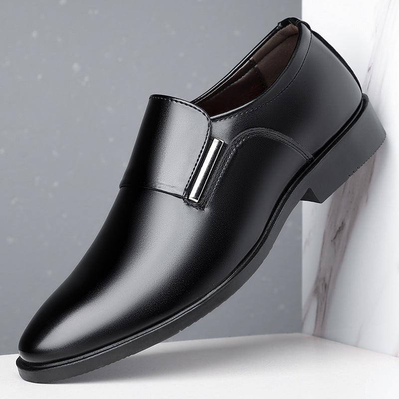 Black leather slip-on dress shoe with strap across vamp and low block heel.