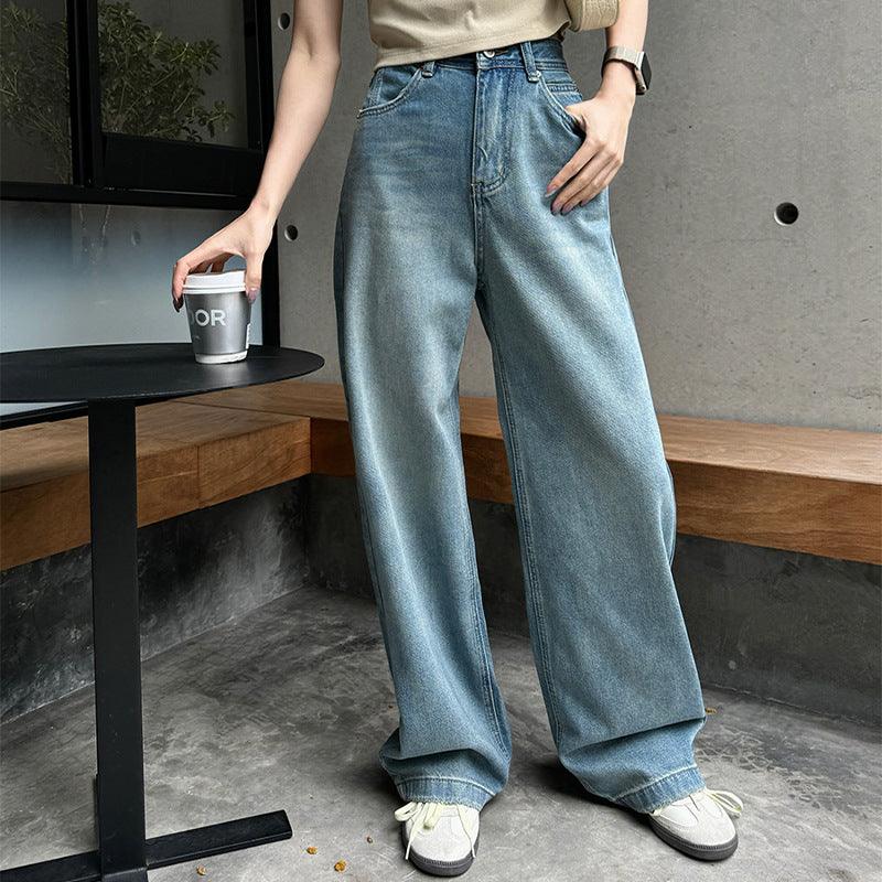 Light blue high-waist wide-leg denim jeans with relaxed drooping fit and belt loops