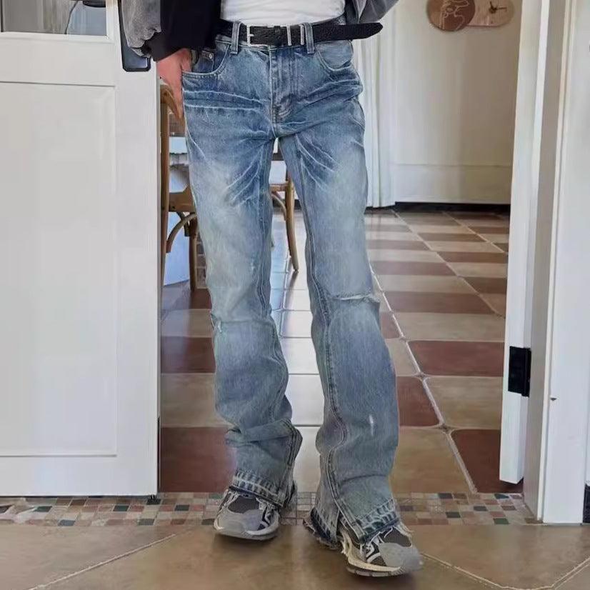 Washed light blue denim jeans with belt loops, flared legs, distressed seams and cuffs