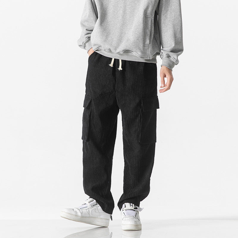Men's black corduroy cargo trousers with front cargo flap pockets and drawstring waist