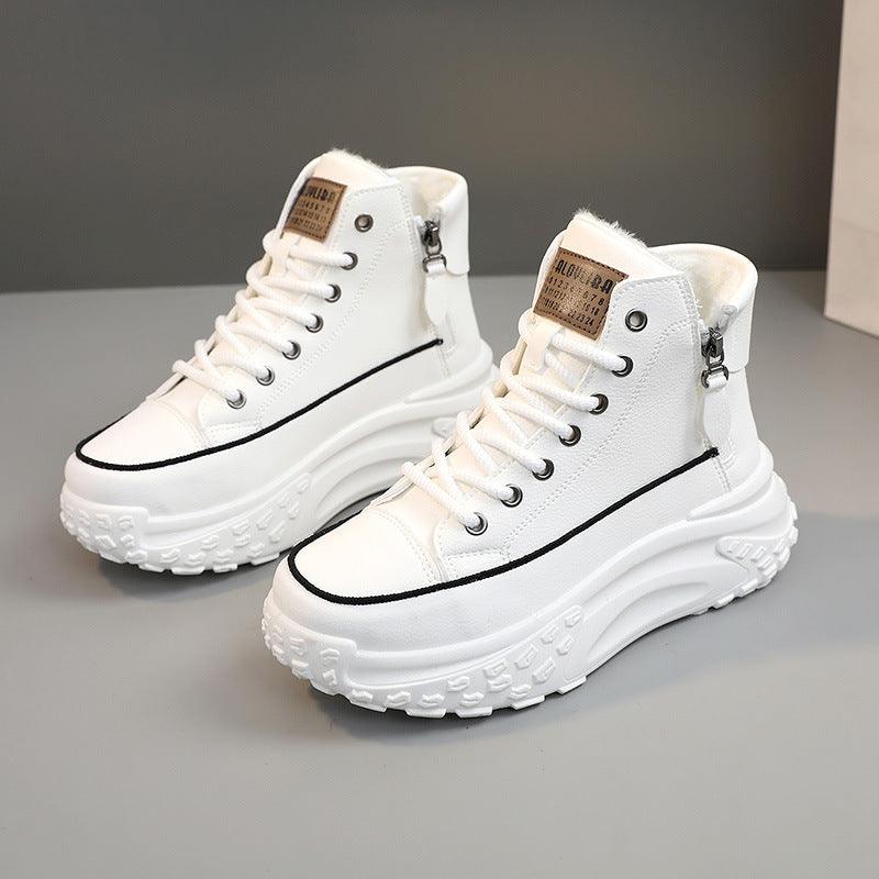 Pair of white high-top sneakers with lace-up front, side zipper tab, and chunky sole