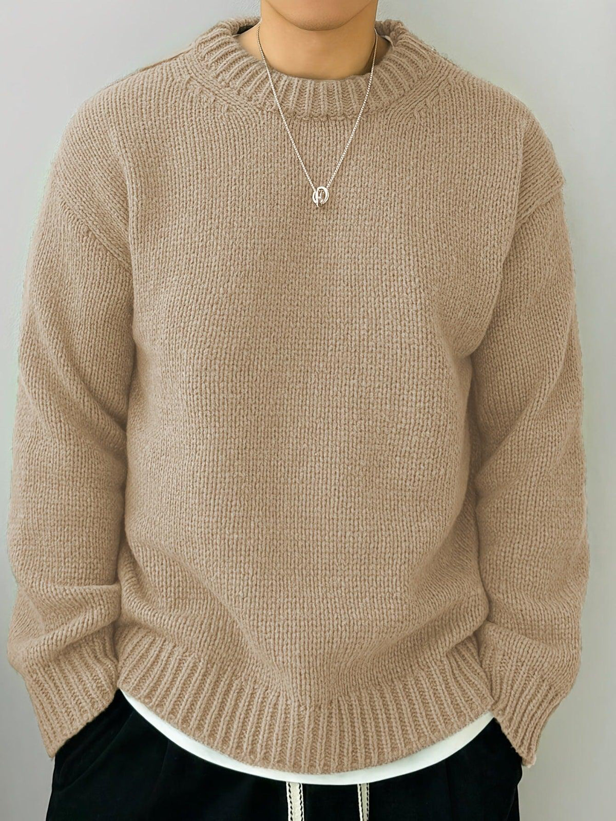 Men's crewneck long-sleeve knit sweater in apricot beige with ribbed neckline and hem