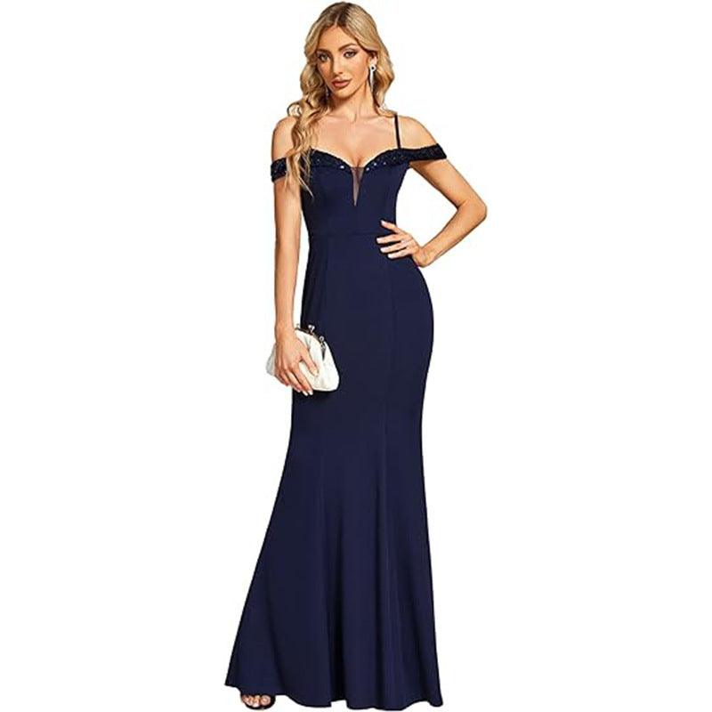 Navy off-shoulder evening gown with jeweled strap detail, fitted mermaid silhouette