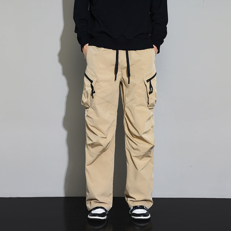 Men's khaki tactical cargo pants with drawstring waist and side pocket zippers
