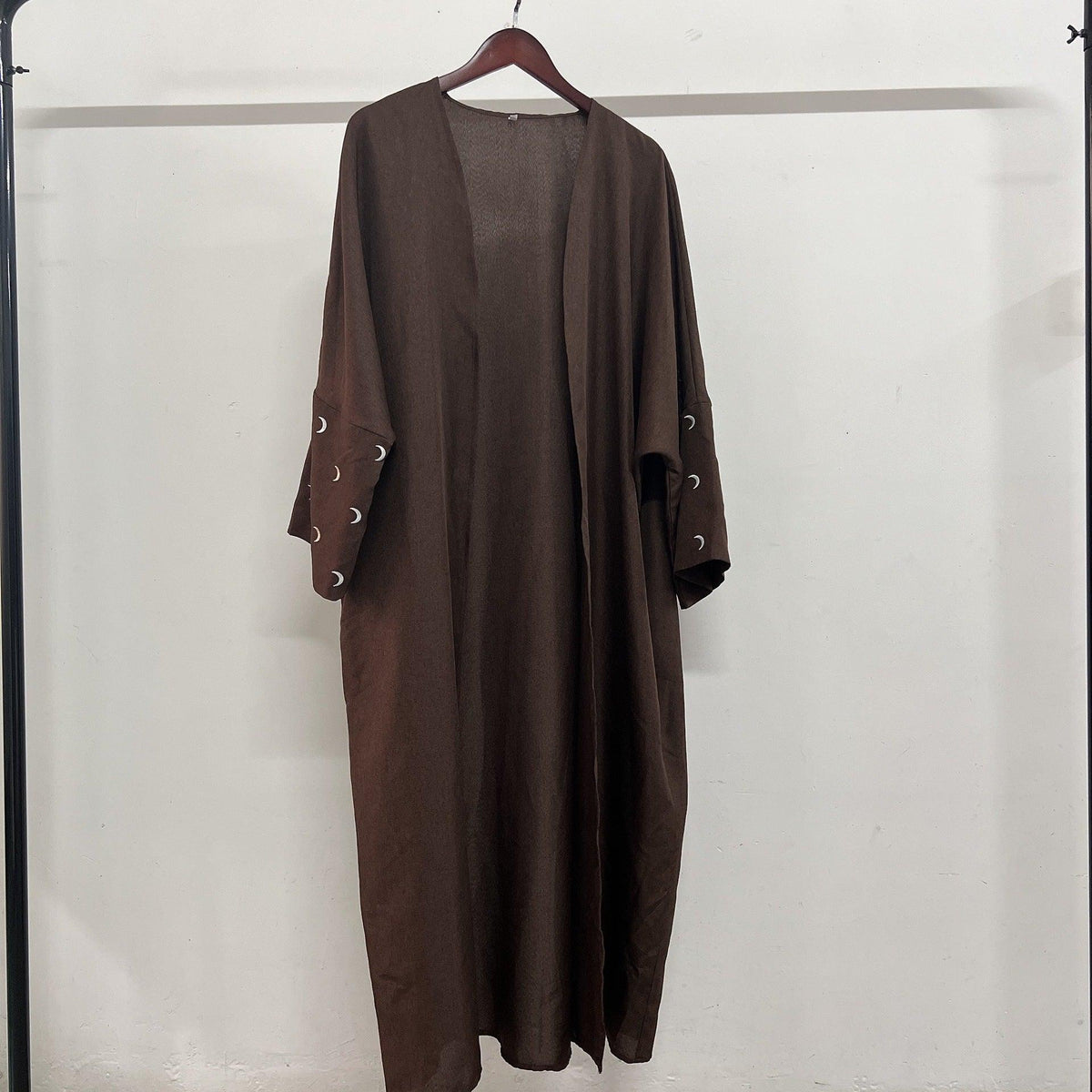 Long embroidered maxi dress, rich brown, loose fit with crescent embroidery on sleeves