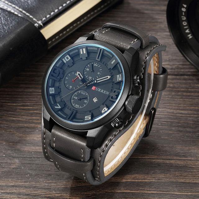 Sports quartz wristwatch with gray strap and muted blue dial with three subdials