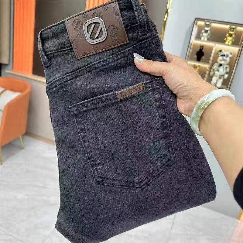 Men's washed dark slim-fit jeans with front pocket and belt-loop waistband patch
