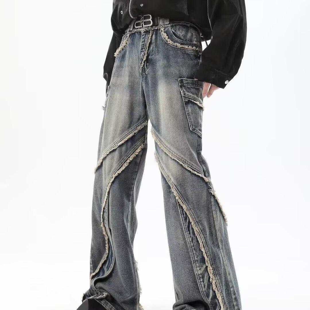 Men's blue skinny jeans with frayed side seams and layered denim panel overlays