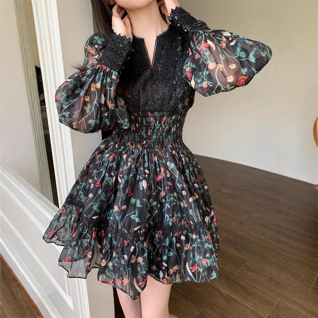 Black V-neck retro printed dress with sheer floral puff sleeves and tiered skirt