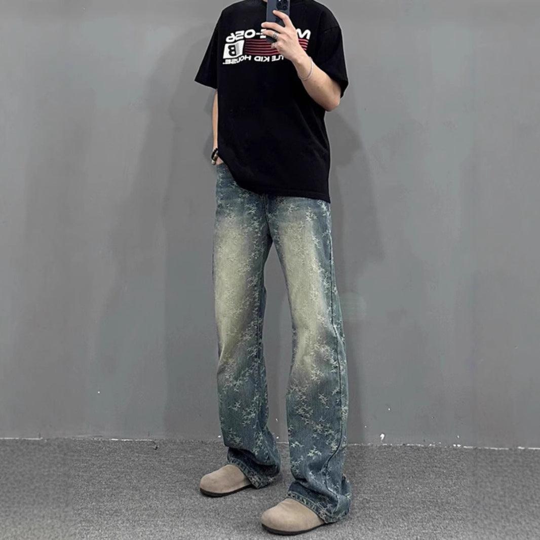 Washed bootcut trousers in light blue with distressed speckled finish