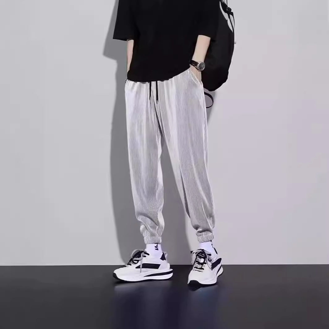 Men's striped sports trousers, light gray jogger style with elastic cuffs and drawstring