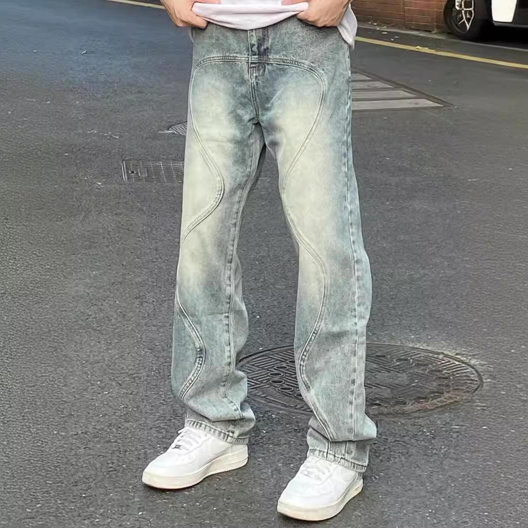 Men's loose wide-leg jeans, faded blue-green wash with curved seam details