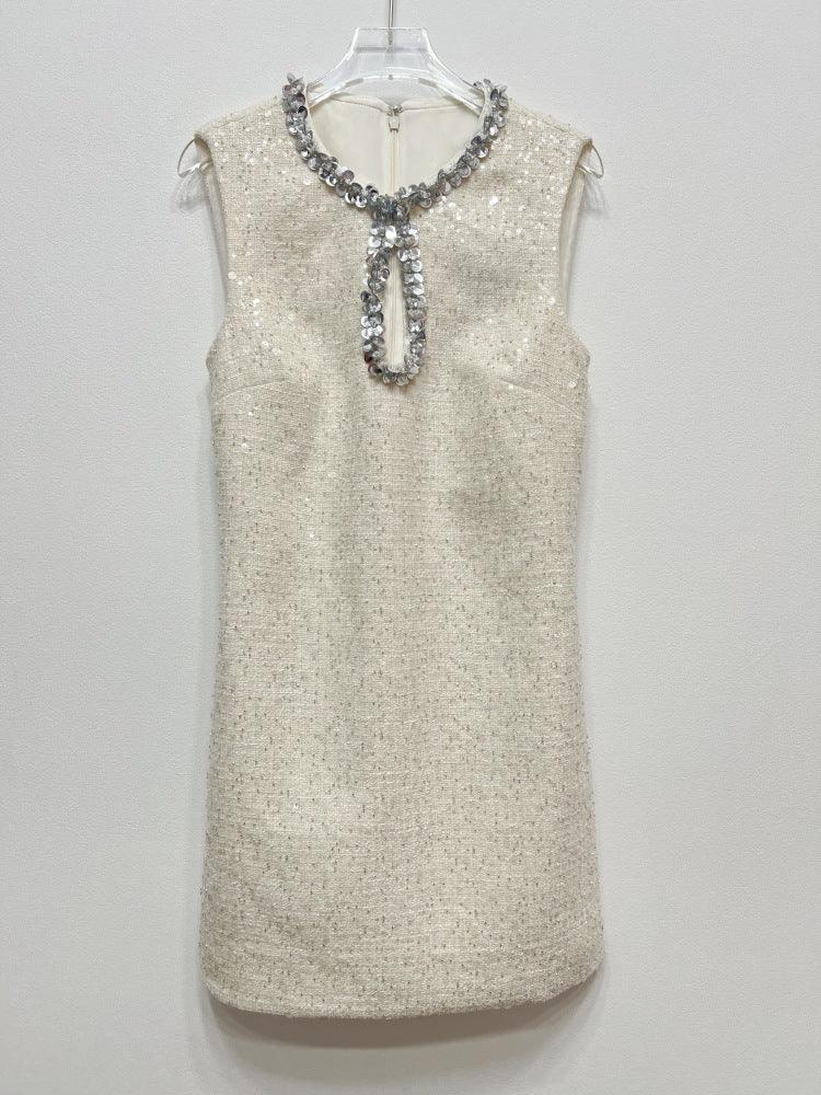 Beige sleeveless sequin shift dress with jeweled keyhole neckline, studio-hung view