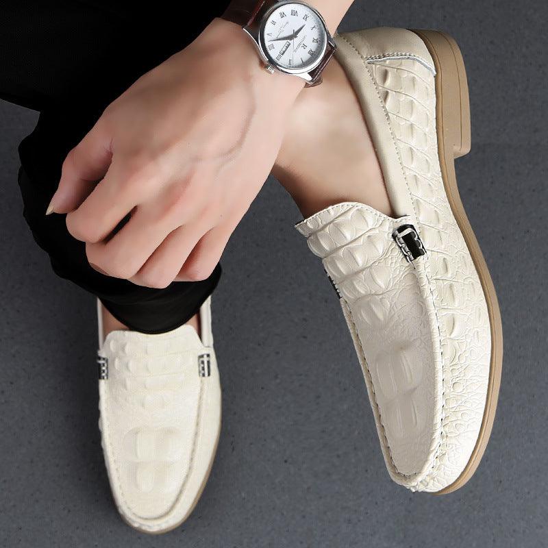 Men's beige embossed leather loafers with metal buckle detail and rubber sole