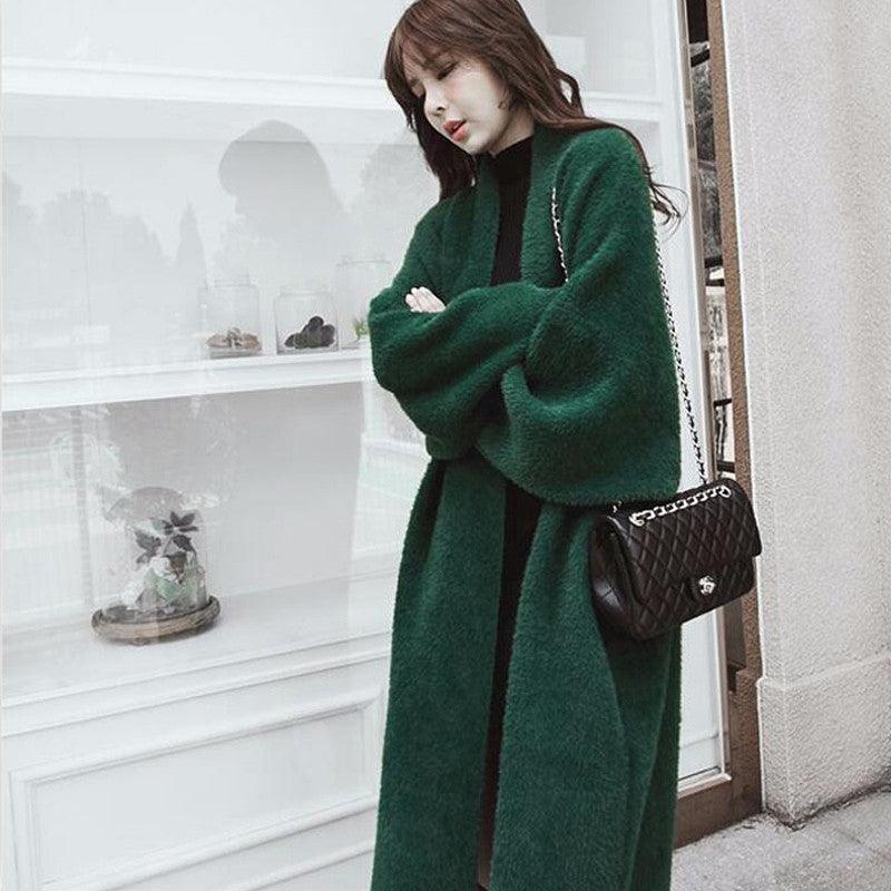 Dark green long fuzzy sweater with open front and belt, long sleeves.