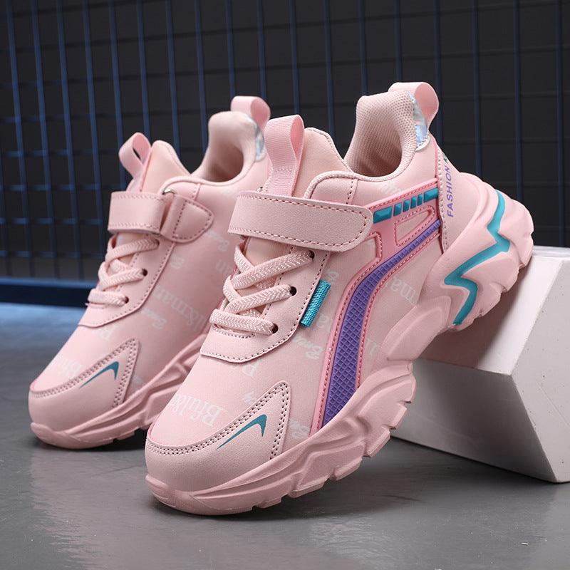 Girls pink casual sneakers with velcro strap, lace-up front, and chunky light sole