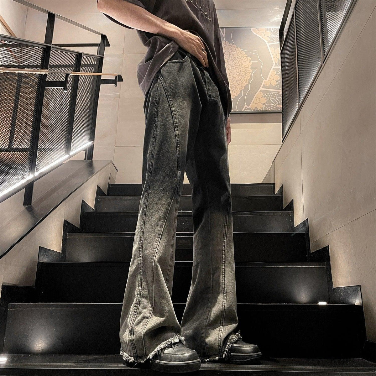 Black and gray gradient washed flared jeans, wide leg silhouette and frayed cuffs