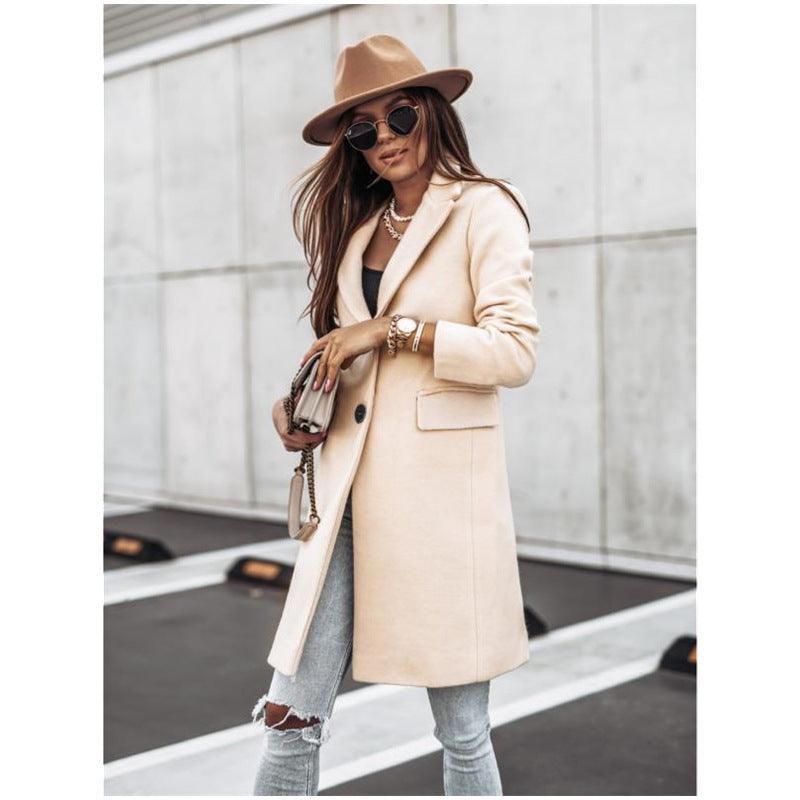 Beige long-sleeve wool coat with front buttons, notch collar, and side pockets.