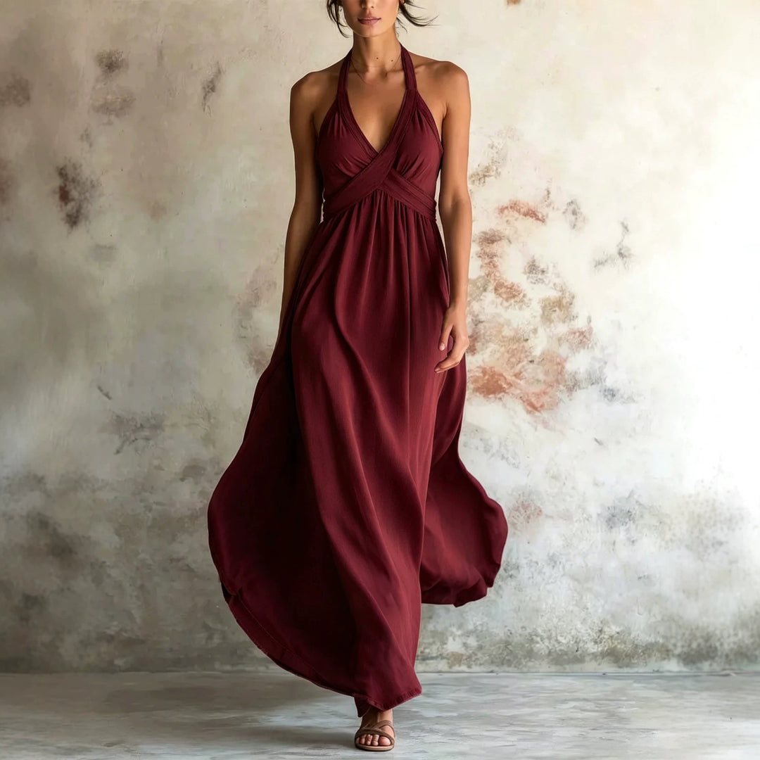 Wine red sleeveless flared maxi dress with halter V-neck and gathered waist