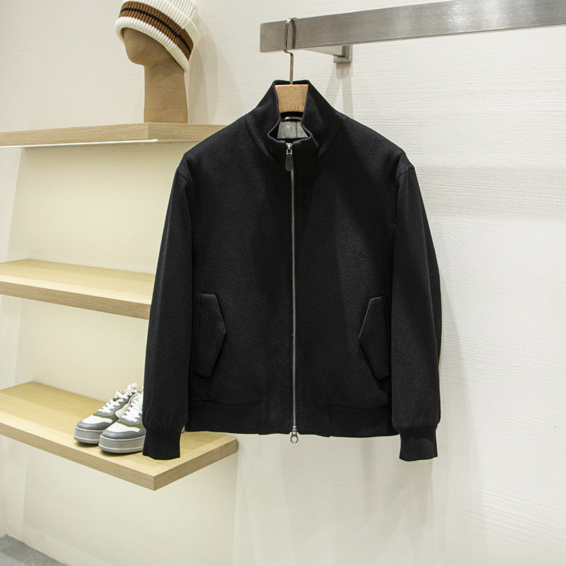 Black padded quilted jacket, full-zip with stand collar and flap pockets.