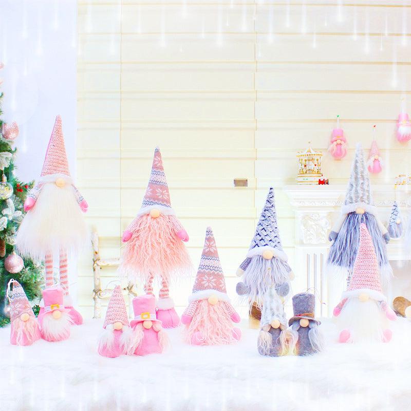Set of Christmas gnome dolls with knit hats and fluffy beards in pink and light blue