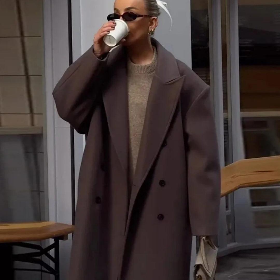 Women’s long dark brown double-breasted coat with notch lapels and front buttons