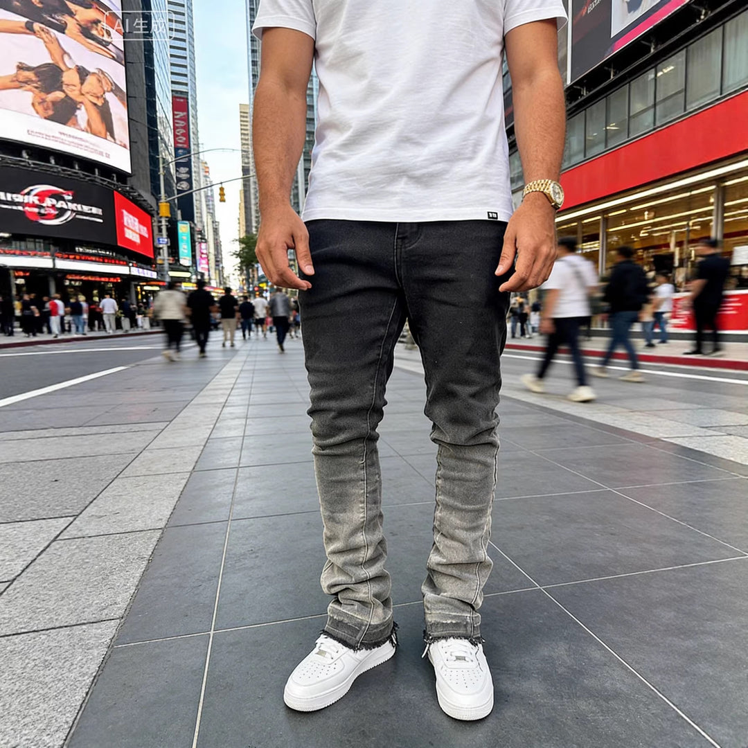 Mens gradient-washed jeans in dark denim, faded knees and distressed ankle hems.