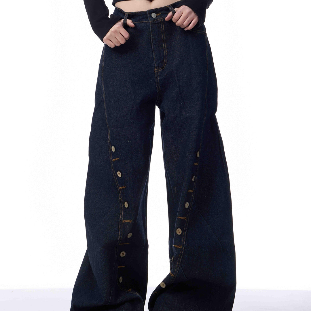 Black denim pants with wide leg and multi-row buttonhole eyelet details