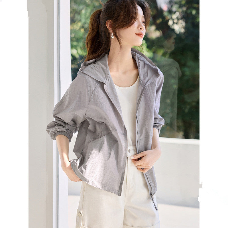 Light gray hooded zip windbreaker jacket with front pockets and elastic cuffs