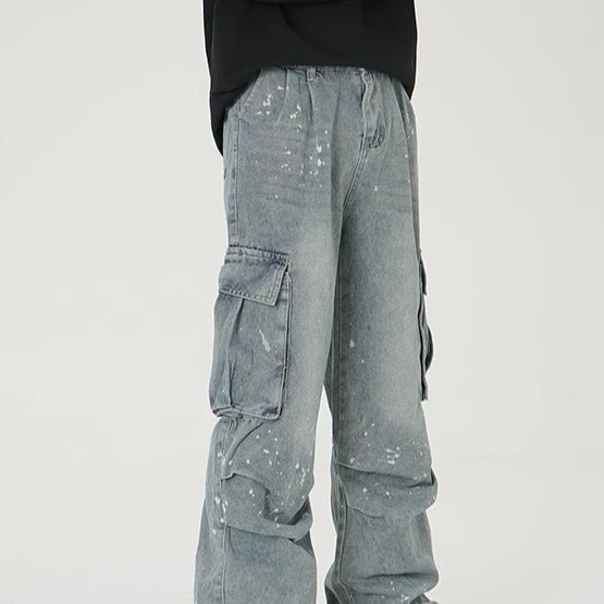 Washed light blue wide-leg denim work pants with large cargo pockets