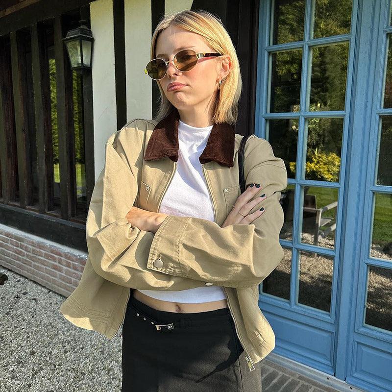 Khaki jacket with dark brown collar, zip front, and flap pockets, long sleeves