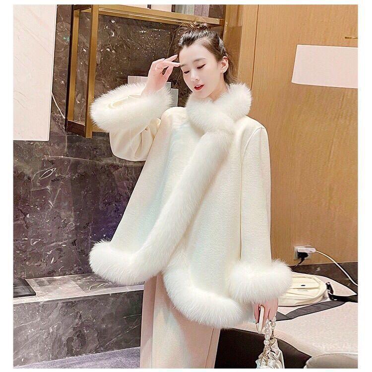 Women’s mid-length faux fur coat in pale cream, open front, wide fur cuffs