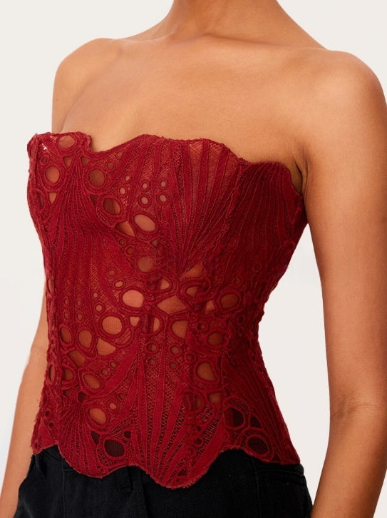 Red lace-print strapless shapewear corset with circular cutout pattern